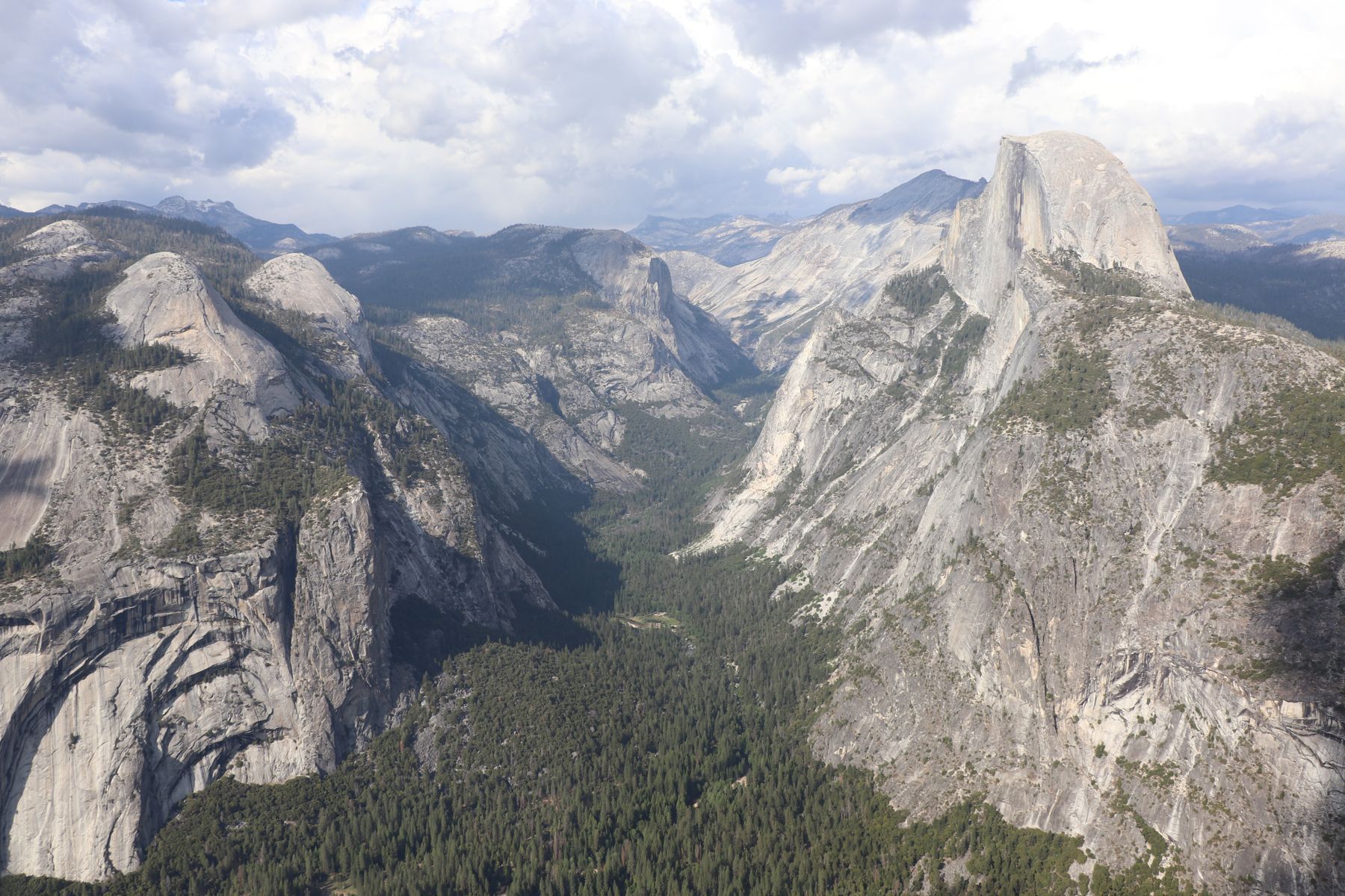 Half Dome and Yosemite Valley under clouds